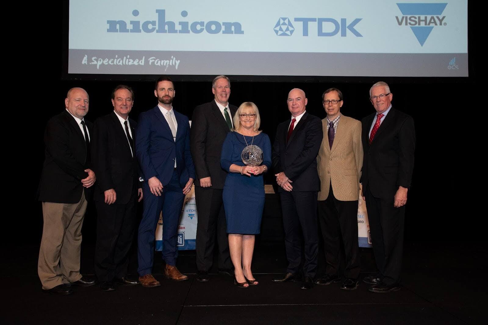 unnamed9.jpg Nichicon’s management executives and sales representatives present to accept the award